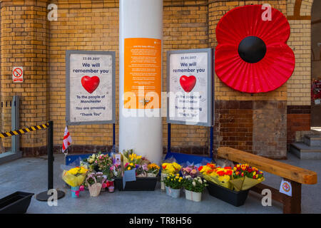 Manchester, UK - May 18 2018: Flowers bought at Manchester Victoria station during the 1 year anniversary of the attack on Manchester Arena where 22 p Stock Photo