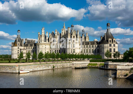 The magnificient architecture of the Royal Chateau of Chambord stands proudly beside the river , Loir-et-Cher, Centre-Val de Loire, France Stock Photo