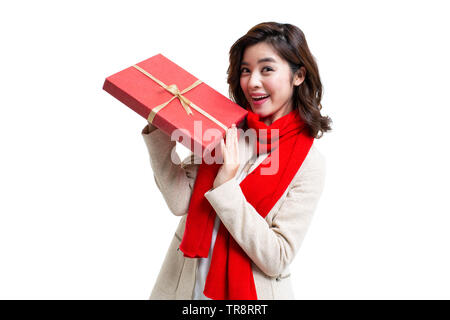 Happy young woman holding gift Stock Photo