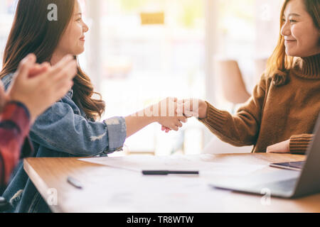 Asian businessman working and shaking hands in a meeting Stock Photo