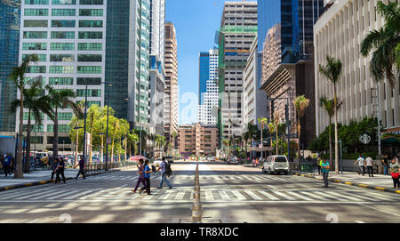 Ortigas, Philippines - July 26, 2016: People are crossing road in Ortigas Stock Photo