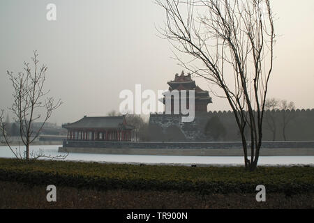 Beijing China, Forbidden City moat and watchtower with polluted sky Stock Photo