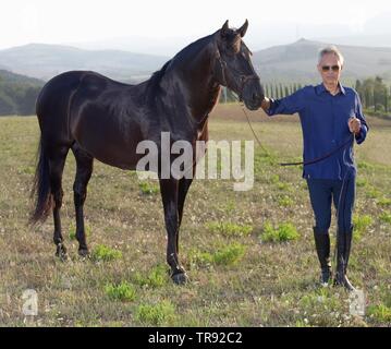 Andrea Bocelli pictured on his brother Alberto's farm, Azienda Agricola Alberto Bocalli, Lajatico, Pisa province, Tuscany, Italy   Photo © Sandro Mich Stock Photo