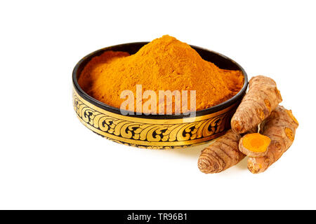 turmeric powder in asian bowl and fresh turmeric roots isolated on white Stock Photo