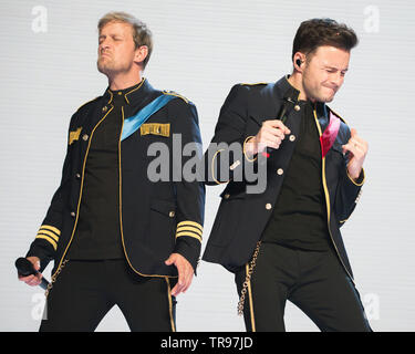 Glasgow, UK. 28 May 2019. World renown boy band, Westlife, in concert at the Hydro Arena in Glasgow during 'The Twenty Tour'.  PICTURED: (left-right) Kian Egan; Shane Filan. Stock Photo
