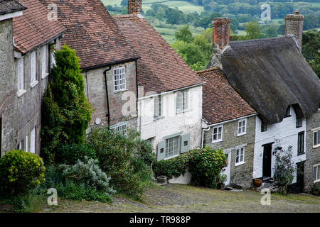 SHAFTESBURY, UK - MAY 19th, 2019: Gold Hill is a steep cobbled street in the town of Shaftesbury in the English county of Dorset. It is famous for its Stock Photo