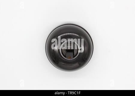 Antique switch on off bakelite, isolated on white background, close-up Stock Photo