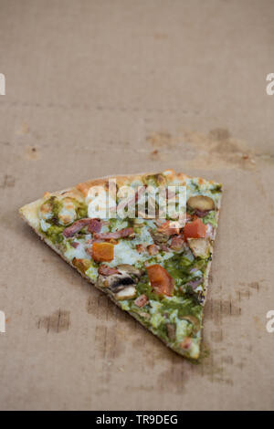 Last one pizza slice in cardboard pizza box. Book cover template. Stock Photo