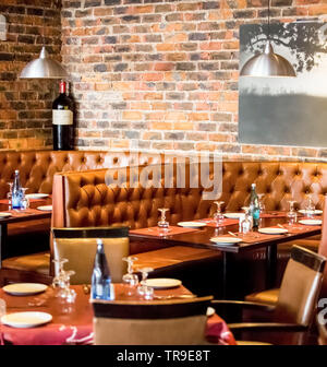 Johannesburg, South Africa - August 07 2013: Interior of Booth Style Restaurant Diner with Brown Interior Stock Photo