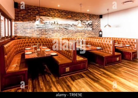 Johannesburg, South Africa - August 07 2013: Interior of Booth Style Restaurant Diner with Brown Interior Stock Photo