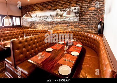 Johannesburg, South Africa - August 07 2013: Interior of Booth Style Restaurant Diner with Brown Interior Stock Photo