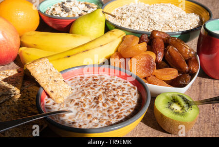 Healthy breakfast ingredients - dried plum, dates, cereal Stock Photo