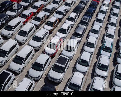 New cars parking lot, aerial view, sunny day Stock Photo