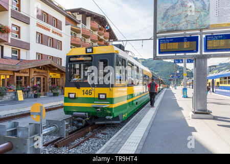 Wengernalpbahn train at Grindelwald terminus station, waiting to depart to Kleine Scheidegg in the Swiss alps for connection to the Jungfrau Railway. Stock Photo