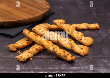 Puff pastry cheese sticks or straws Stock Photo