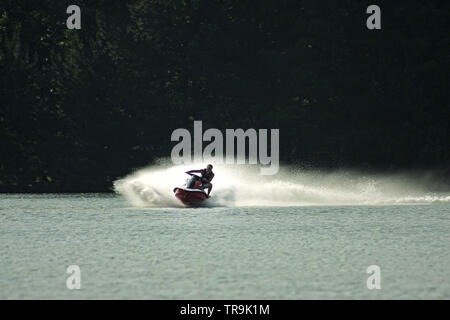 SPORT Watersports Jet Ski Man riding a jet ski on the sea at Littlehampton in West Sussex