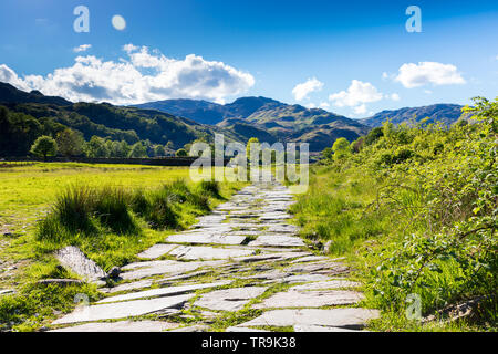 The walk ahead to the fells starts from the paths in Grasmere in the Lake District National Park Stock Photo