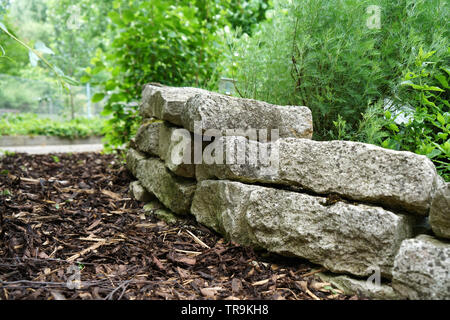 With natural stones in the garden or park artfully bricked Stock Photo