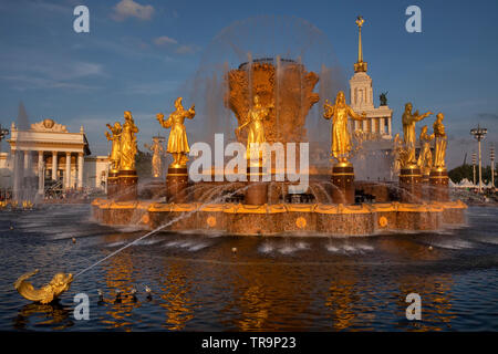 Fountain 'Friendship of peoples' after the restoration and the facade of pavilion №1 'Central' (House of peoples of the USSR) at VDNH in Moscow, Russi Stock Photo