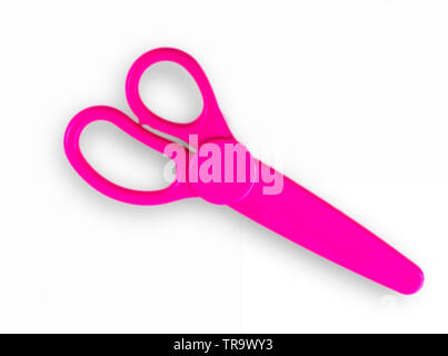 Pink baby scissors cut out on a white background. View from above Stock Photo