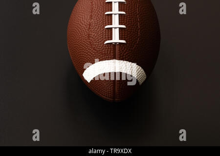 American football isolated on black background . Sport object concept Stock Photo