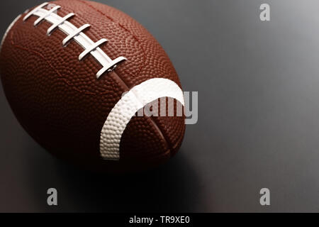 American football isolated on black background . Sport object concept Stock Photo