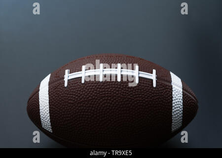 American football isolated on black background . Sport object concept Stock Photo