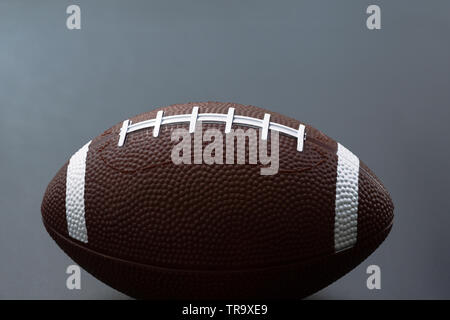 American football isolated on black background . Sport object concept Stock Photo