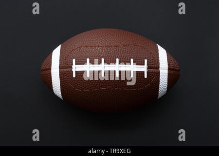 American football isolated on black background . Sport object concept Stock Photo