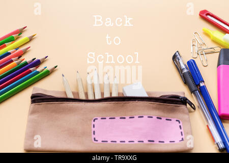 Welcome back to school background, colorful color pencil and stationery bag on yellow backgrounds with copy space Stock Photo