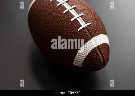 American football isolated on black background . Sport object concept Stock Photo