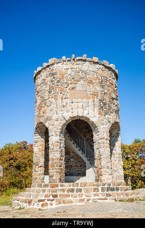 Observation tower at the peak of Mount Battie in Camden, Maine, USA. Sunny, autumn day with bright blue sky background. Stock Photo