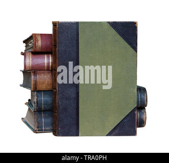 Ancient book in green hardcover against the stack of thick books, isolated on white background, with space for text Stock Photo