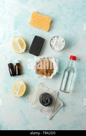 Zero waste, compostable domestic cleaning tools. Metal dish brush, cellulose sponge, rags, soap, lemon, vinegar, essential oils . Eco friendly concept Stock Photo