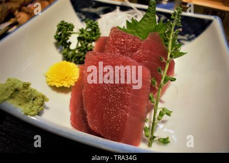 Maguro Sashimi with Sake at an Izakaya, Tokyo, Japan Stock Photo