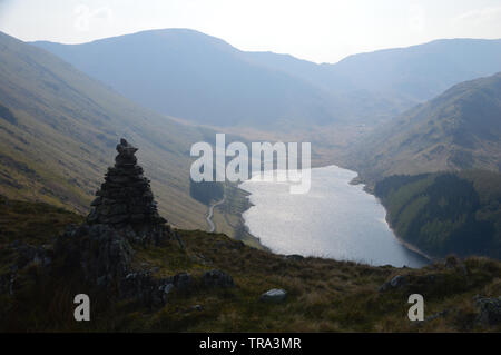 Harter Fell, Nan Bield Pass and Mardale Ill Bell from a Stone Cairn on the Old Corpse Road to Swindale Head in Mardale above Haweswater Reservoir. Stock Photo