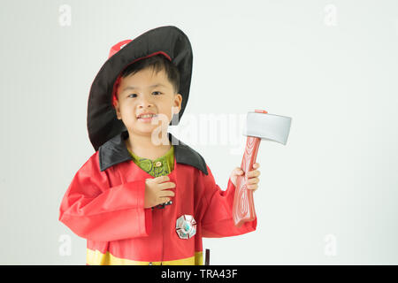 Children wearing fire extinguishers holding axe on white background, Stock Photo
