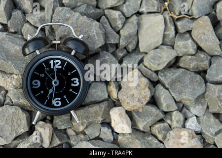 black alarm clock on stone background, Stock Photo