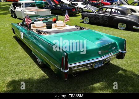 A green 1970 Cadillac De Ville Convertible amongst vintage vehicles and Hot Rods at a memorial day event at Boulder City, Nevada, USA Stock Photo