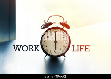 work life balance concept, alarm clock with word Work and Life Stock Photo