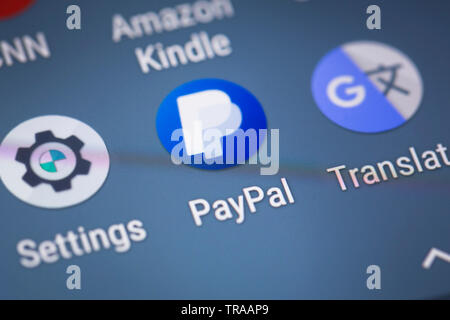 Paypal logo icon on mobile phone screen Stock Photo