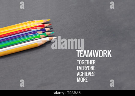 Teamwork concept. group of color pencil on black background with word Teamwork, Together, Everyone, Achieves and More Stock Photo