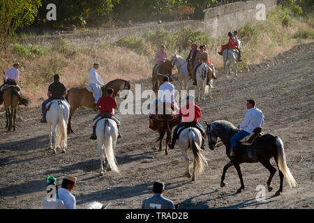 Benamargosa Romeria 2019. Villagers making a pilgrimage along the dry riverbed in the village of  Benamargosa to honour of the Virgin of the Purist. Stock Photo