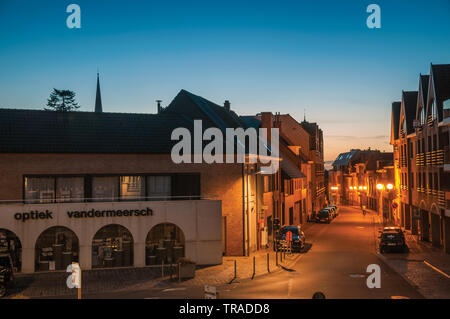 View of street with houses at dusk in Tielt. Charming and quiet village in the countryside of Belgium. Stock Photo