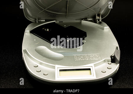 Naples, Italy, 21 / April / 2019. An old open CD player, the display is visible, the internal keys, but also the laser to read the cd. Stock Photo