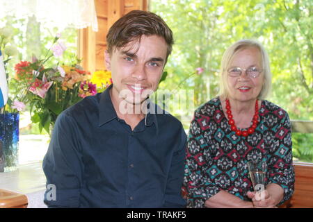 Grandmother and grandson celebration in Finnish summer cottage Stock Photo