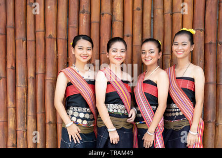 Group portrait of Kadazan Dusun young girls in traditional attire from Kota Belud district during state level Harvest Festival in KDCA, Kota Kinabalu, Stock Photo