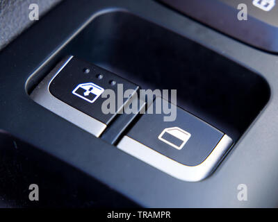 Window control buttons on the side of the car door Stock Photo