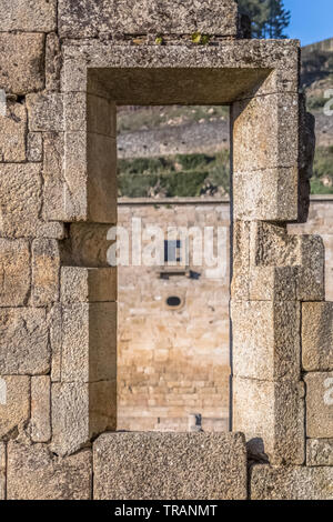 Tarouca / Portugal - 03 15 2018: View of historic building in ruins, convent of St. Joao of Tarouca, detail of ruined wall with hole door, and blurred Stock Photo