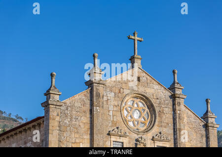 Tarouca / Portugal - 03 15 2018: View of historic building in ruins, convent of St. Joao of Tarouca, front facade detail of Romanesque church Stock Photo